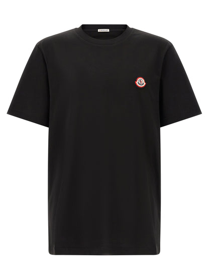 T-Shirt by Moncler for men in cotton black showcases a chic silhouette, artfully detailed with a chic crew neckline and short-sleeve for a chic finish.