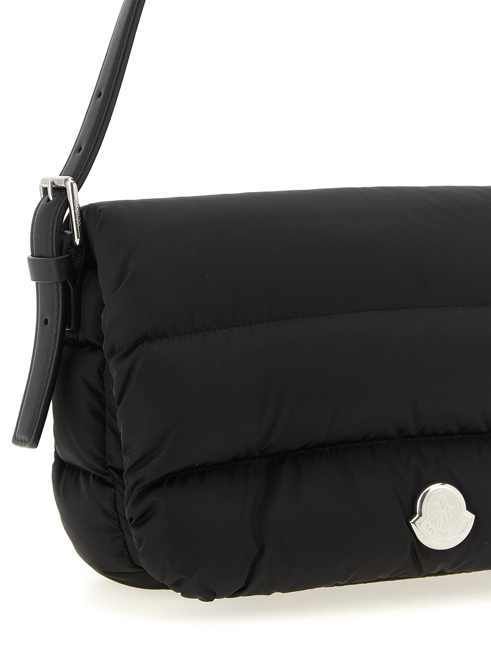 Mini Shoulder Flap Bag by Moncler for women in polyamide leather black, silver & signature showcases a enviable silhouette, artfully detailed with a secure flap, magnetic & buckle, organized , and versatile shoulder-strap, adjustable-strap & handle for a enviable look.