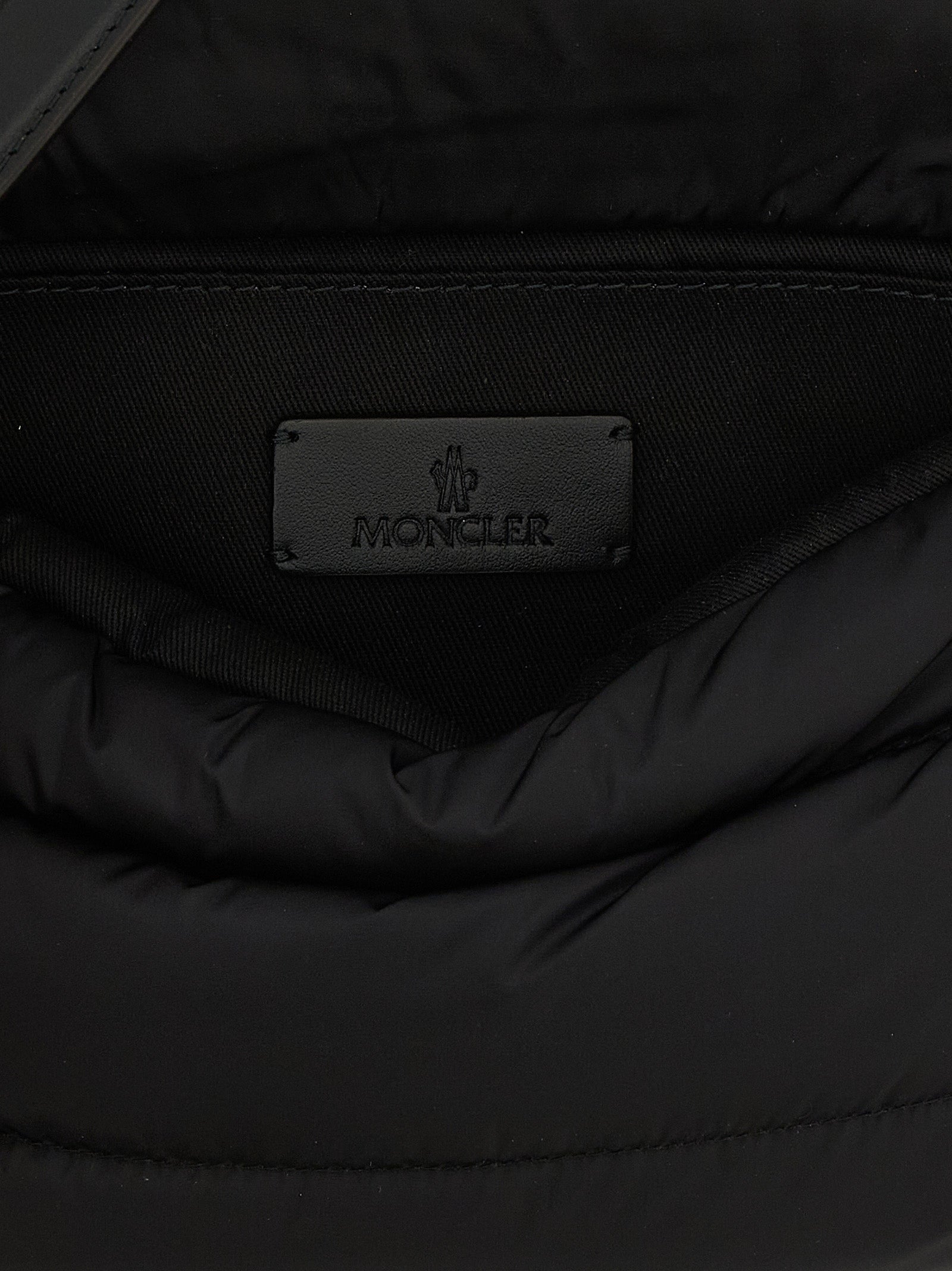 Mini Shoulder Flap Bag by Moncler for women in polyamide leather black, silver & signature features a enviable silhouette, showcasing a secure flap, magnetic & buckle, ample , and enviable shoulder-strap, adjustable-strap & handle for a enviable finish.