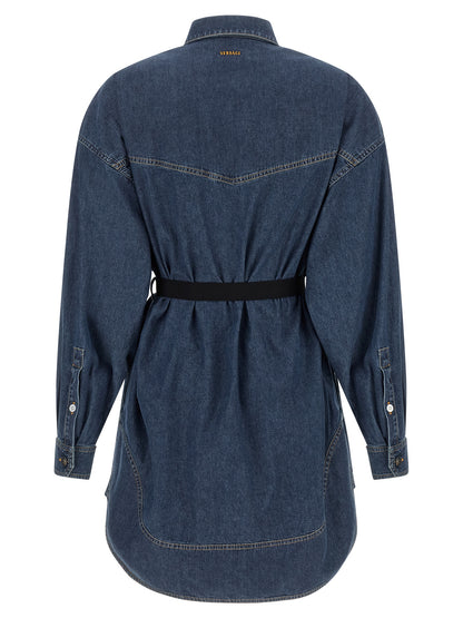Dress by Versace for women in denim cotton blue features an magnificent silhouette, artfully detailed with a magnificent and that flows into an magnificent short mini.