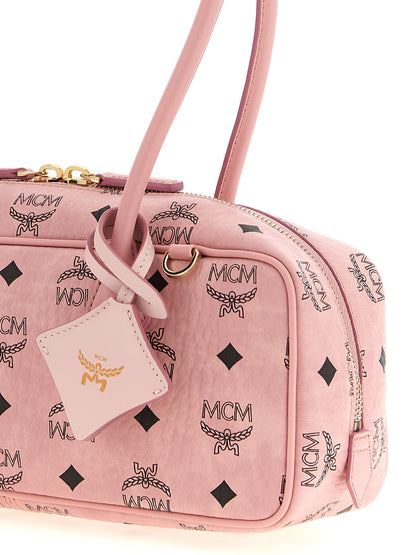 East West Shoulder Bag by MCM for women in suede polyethylene leather & coated canvas gold, multicolor, pink, patterned & monogram showcases a enviable silhouette, artfully detailed with a secure zipper, organized cardholder, and versatile shoulder-strap, detachable-strap & handle for a enviable look.