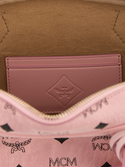 East West Shoulder Bag by MCM for women in suede polyethylene leather & coated canvas gold, multicolor, pink, patterned & monogram features an effortlessly chic silhouette with a secure zipper, ample cardholder, and versatile shoulder-strap, detachable-strap & handle for effortlessly chic everyday luxury.