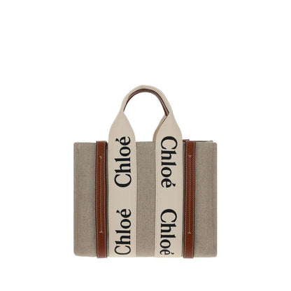 This Tote Handbag by Chloé for women in linen & leather and brown & monogram presents a sculptural silhouette featuring a secure , ample internal-pockets, and versatile shoulder-strap, handle & adjustable-strap for a sculptural finish.