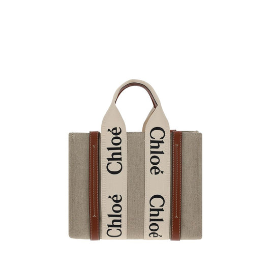 This Tote Handbag by Chloé for women in linen & leather and brown & monogram presents a sculptural silhouette featuring a secure , ample internal-pockets, and versatile shoulder-strap, handle & adjustable-strap for a sculptural finish.
