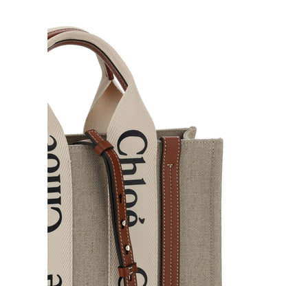 Tote Handbag by Chloé for women in linen & leather brown & monogram features a signature silhouette, showcasing a secure and signature internal-pockets with versatile shoulder-strap, handle & adjustable-strap for a sophisticated look.