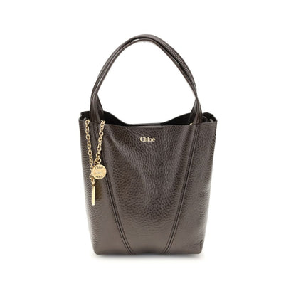 Shoulder Bag by Chloé for women in bos taurus grained leather brown & monogram features a effortless chic silhouette with a secure magnetic & button, ample single-compartment, and versatile shoulder-strap, handle & adjustable-strap for a effortless chic finish.