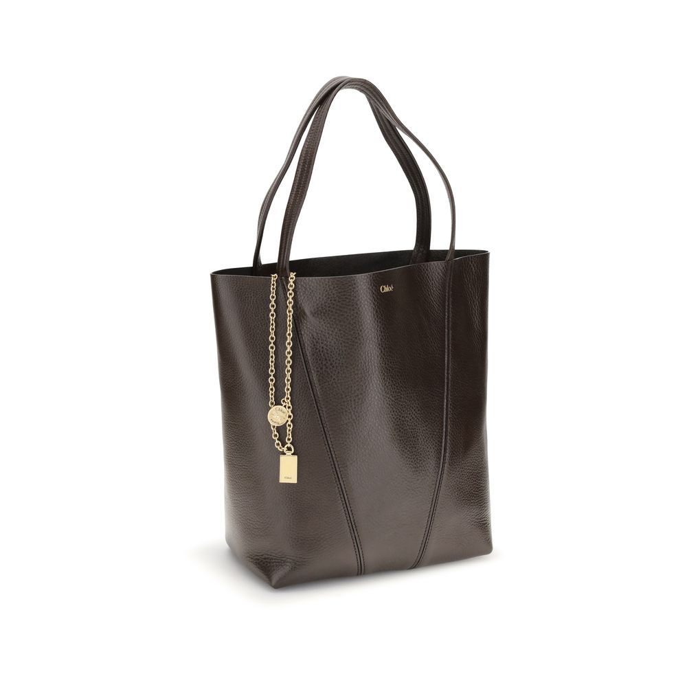 Shoulder Bag by Chloé for women in bos taurus calf grained leather brown & monogram presents a versatile silhouette, showcasing a secure and versatile single-compartment with versatile shoulder-strap & handle for a sophisticated look.