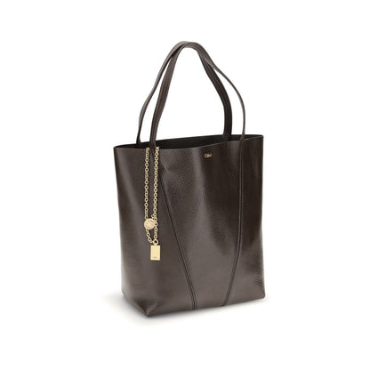 Shoulder Bag by Chloé for women in bos taurus calf grained leather brown & monogram presents a versatile silhouette, showcasing a secure and versatile single-compartment with versatile shoulder-strap & handle for a sophisticated look.