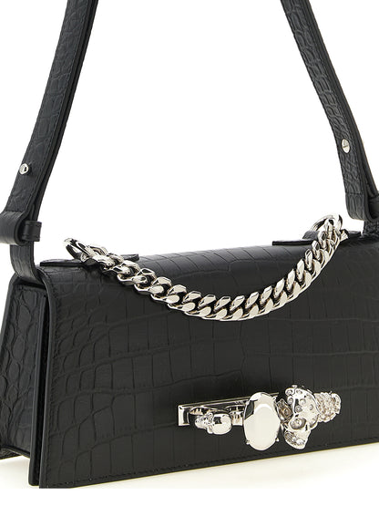Mini Shoulder Flap Bag by Alexander McQueen for women in bos taurus crocodile calfskin leather black & signature features a effortless sophistication silhouette, secured by a flap & magnetic with ample and versatile shoulder-strap, adjustable-strap & handle for a effortless sophistication finish.