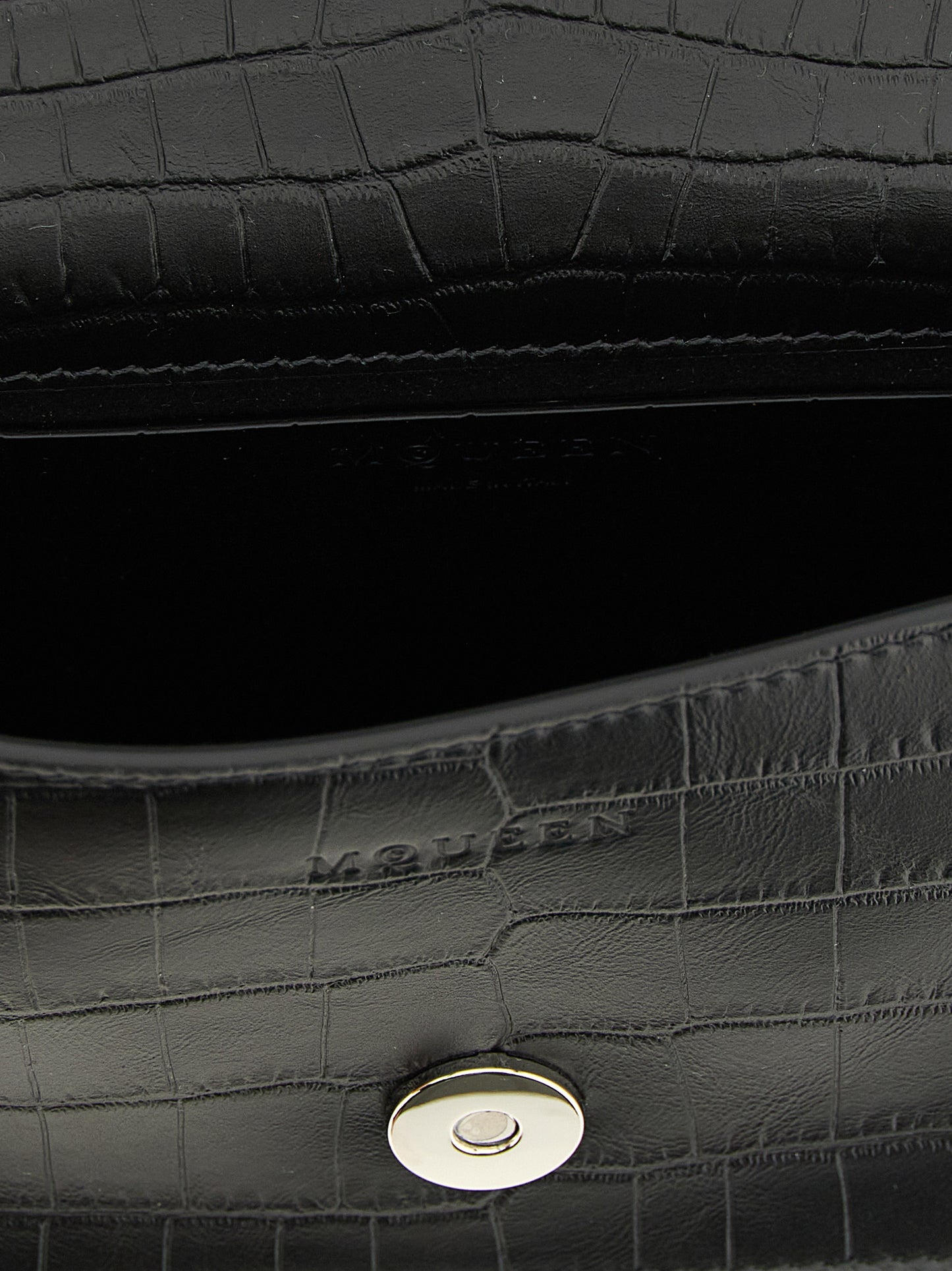 Mini Shoulder Flap Bag by Alexander McQueen for women in bos taurus crocodile calfskin leather black & signature features a enviable silhouette, showcasing a secure flap & magnetic, ample , and enviable shoulder-strap, adjustable-strap & handle for a enviable finish.