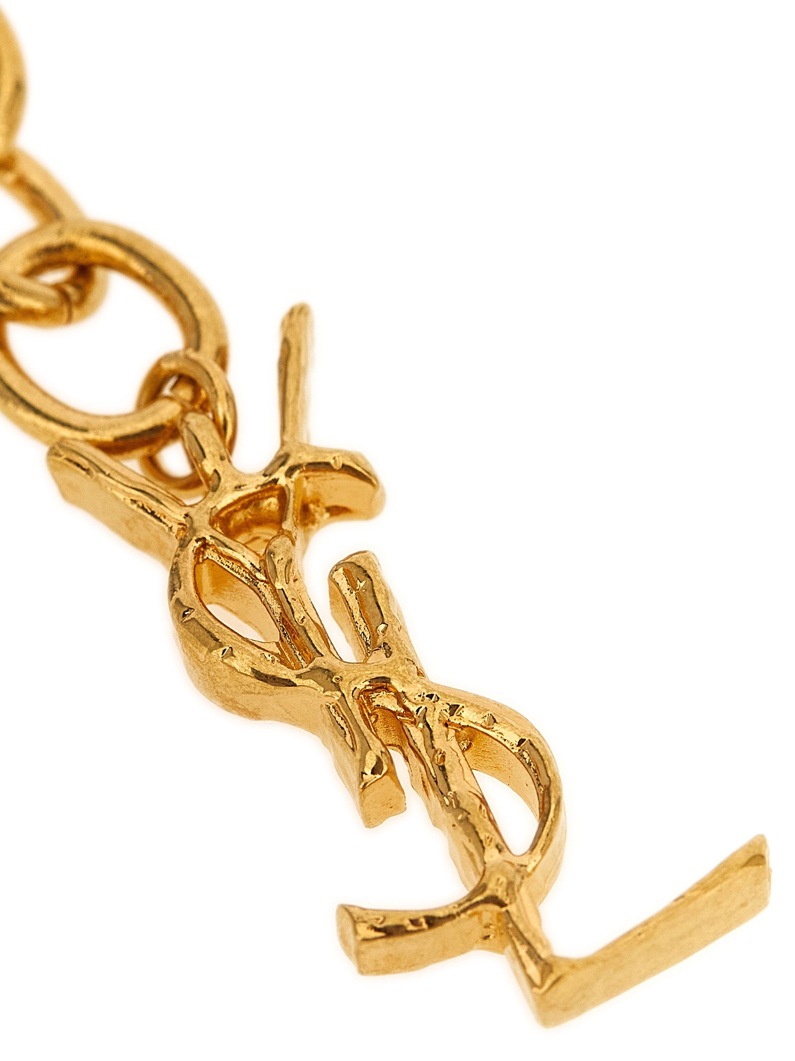 Bracelet by Saint Laurent for women in cashmere cotton & silk gold showcases a enchanting silhouette, artfully highlighting the chain charm woven bracelet design and signature Cassandre Women's Chain Charm Woven Gold Brass Bracelet aesthetic in this enchanting piece.