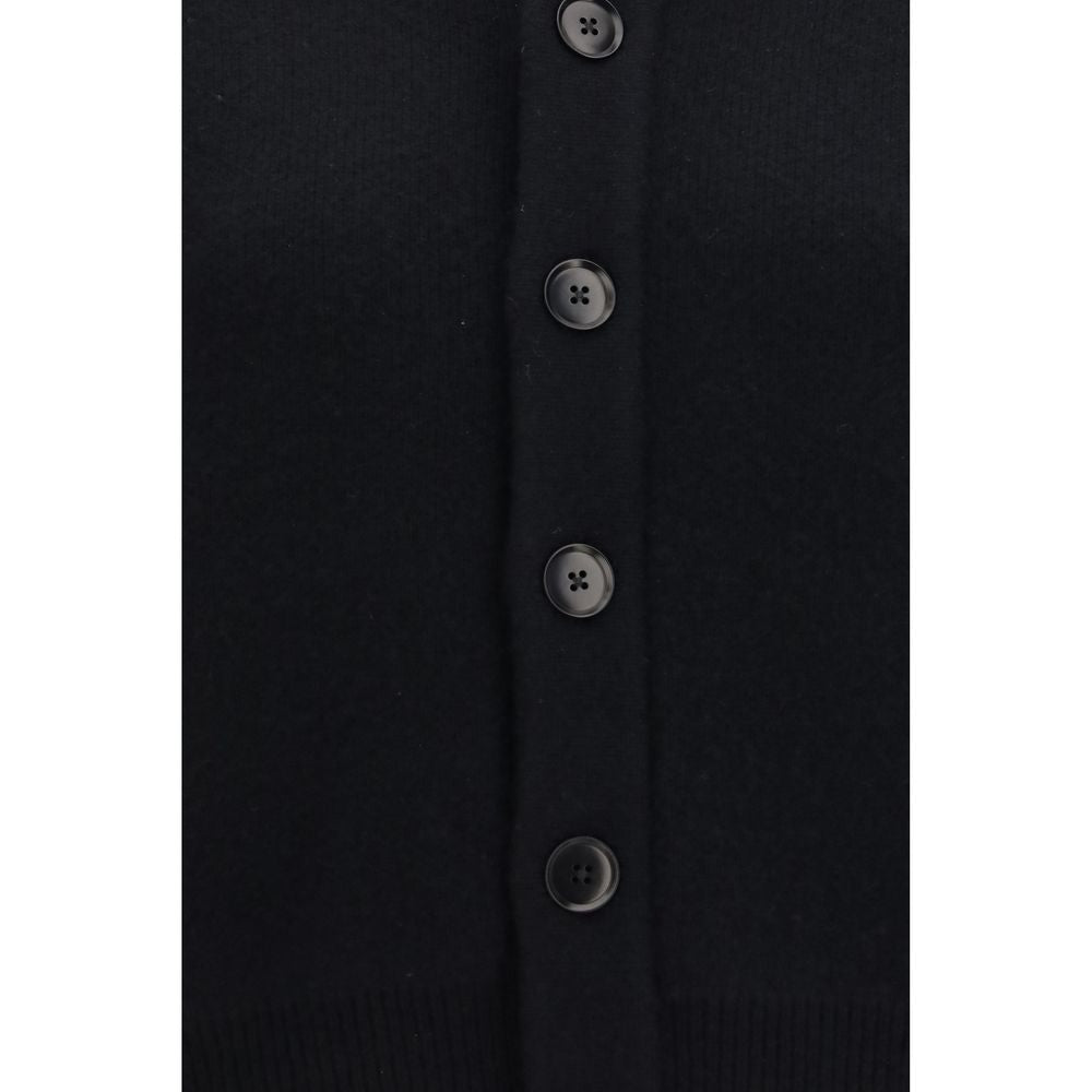Cardigan by Extreme Cashmere for women in cashmere & capra leather black showcases a captivating silhouette, artfully detailed with a captivating and for a truly sophisticated captivating look.