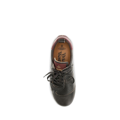 Sneakers by Vivienne Westwood for women in distressed bos taurus calf leather black & print presents a sumptuous silhouette, artfully capturing the essence of the Orb Women's Fashion Distressed Bos Taurus Calf Leather Sneakers with its sumptuous fashion style design.