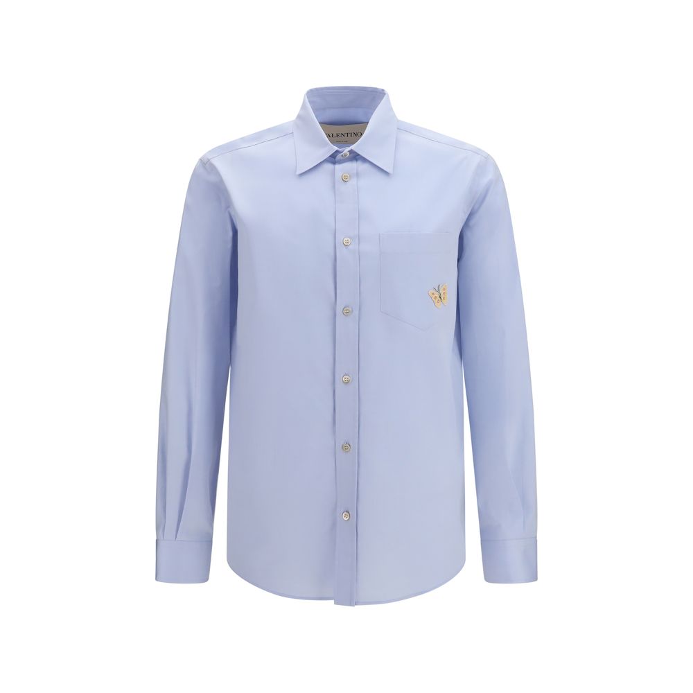 Dress Shirt by Valentino Garavani for men in cotton blue showcases a sharp silhouette, elegantly detailed with a sharp and sharp .