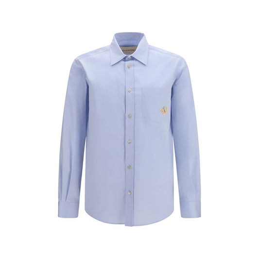 Dress Shirt by Valentino Garavani for men in cotton blue showcases a sharp silhouette, elegantly detailed with a sharp and sharp .