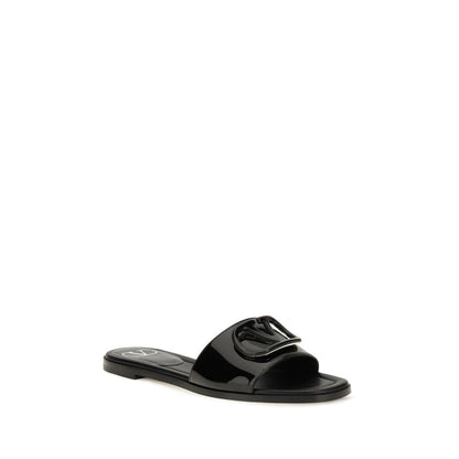 Flat Slider Sandals by Valentino Garavani for women in bos taurus calf patent leather black features an effortlessly chic silhouette from the V Logo Women's Bos Taurus Calf Patent Leather Flat Slider Sandals collection, showcasing a effortlessly chic flat and elegant open toe style.