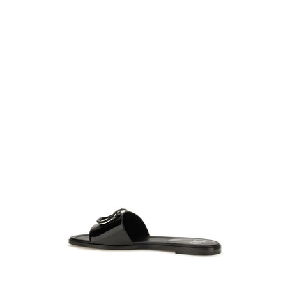 Flat Slider Sandals by Valentino Garavani for women in bos taurus calf patent leather and black presents a captivating silhouette, showcasing the signature style of the V Logo Women's Bos Taurus Calf Patent Leather Flat Slider Sandals with a captivating flat and captivating open toe style.
