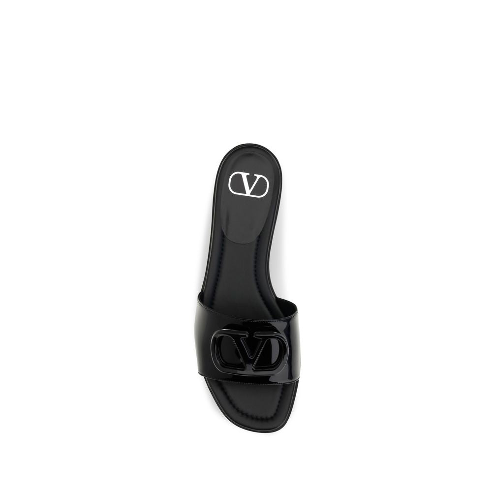 Flat Slider Sandals by Valentino Garavani for women in bos taurus calf patent leather black features an statuesque V Logo Women's Bos Taurus Calf Patent Leather Flat Slider Sandals silhouette with a refined flat and elegant open toe style.