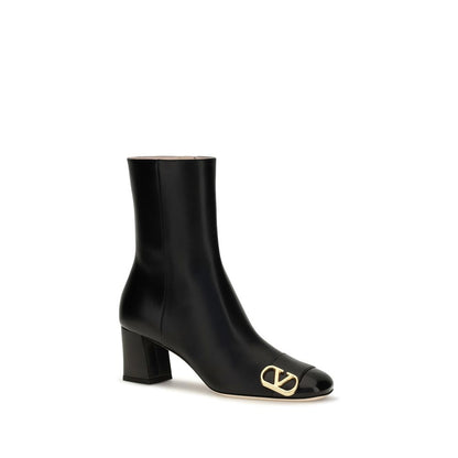 Ankle Boots by Valentino Garavani for women in bos taurus calf leather black showcases a impeccable silhouette as V Logo Women's Bos Taurus Calf Leather Ankle Boots, artfully defined by a impeccable block-heel and a impeccable .