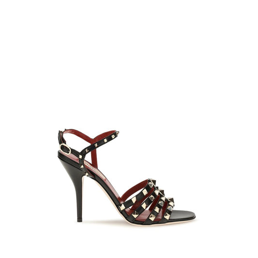 Stiletto Sandals by Valentino Garavani for women in goatskin leather black presents a sculptural silhouette, showcasing the Rockstud Women's Goatskin Leather Stiletto Sandals design with a sculptural stiletto and for a premium look.