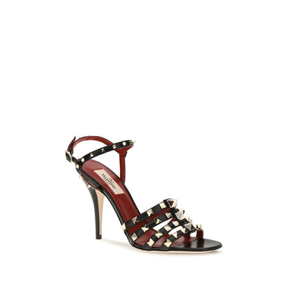 Stiletto Sandals by Valentino Garavani for women in goatskin leather black showcases a sculptural silhouette as Rockstud Women's Goatskin Leather Stiletto Sandals, defined by a sculptural stiletto and sculptural for a sculptural look.