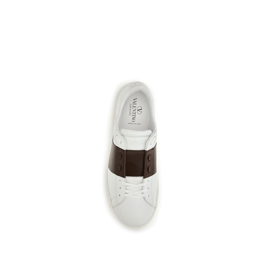 Sneakers by Valentino Garavani for men in bos taurus calf leather white presents a sumptuous silhouette, artfully capturing the essence of the Men's Low Top Slip On Bos Taurus Calf Leather Sneakers with its sumptuous low-top slip-on style design.