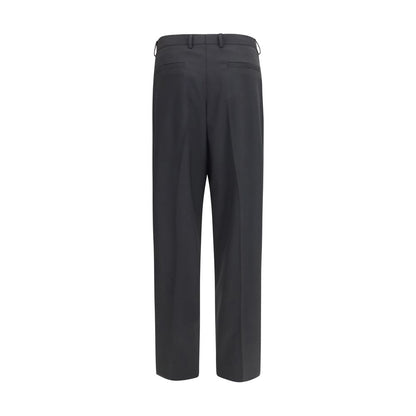 Trousers by Dolce & Gabbana for men in wool black presents a perennial silhouette, meticulously tailored with a regular-fit & wide cut, long finish, and an elegant .