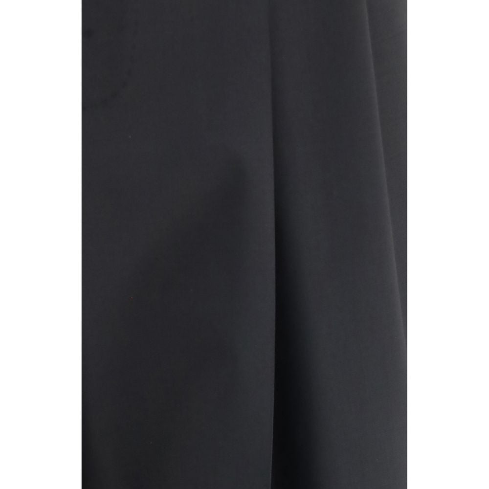Trousers by Dolce & Gabbana for men in wool black features an sartorial silhouette, showcasing a precise regular-fit & wide and long with a sartorial for a refined look.