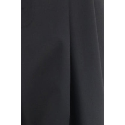 Trousers by Dolce & Gabbana for men in wool black features an sartorial silhouette, showcasing a precise regular-fit & wide and long with a sartorial for a refined look.