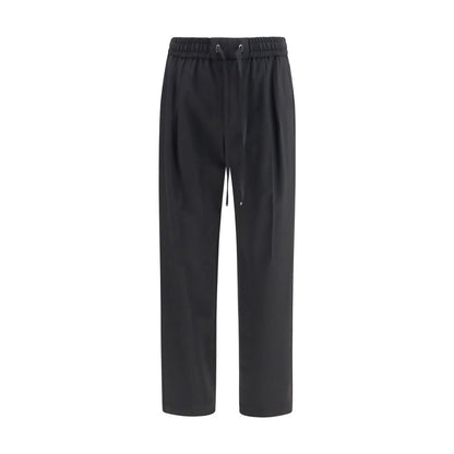 Joggers by Dolce & Gabbana for men in virgin wool black features an sophisticated and regular-fit with a precise long, creating a sophisticated and sophisticated silhouette.