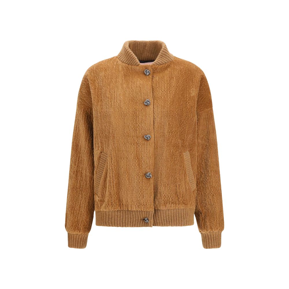 This Bomber Jacket by Kristina Ti for women in modal cotton corduroy brown exhibits a edgy silhouette, meticulously detailed with functional pockets and a edgy high-collar neckline for a edgy finish.