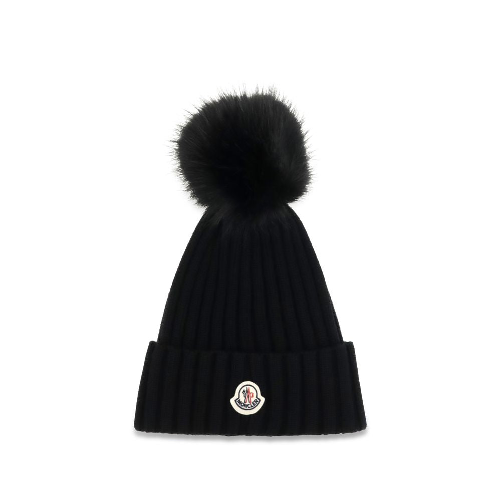 Beanie Hat by Moncler for women in virgin wool black presents a sleek silhouette, showcasing the sleek texture and refined craftsmanship of the Virgin Wool Beanie Hat collection.