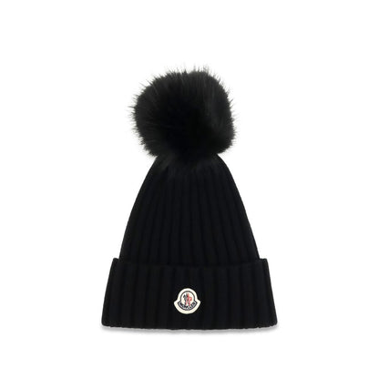 Beanie Hat by Moncler for women in virgin wool black presents a sleek silhouette, showcasing the sleek texture and refined craftsmanship of the Virgin Wool Beanie Hat collection.