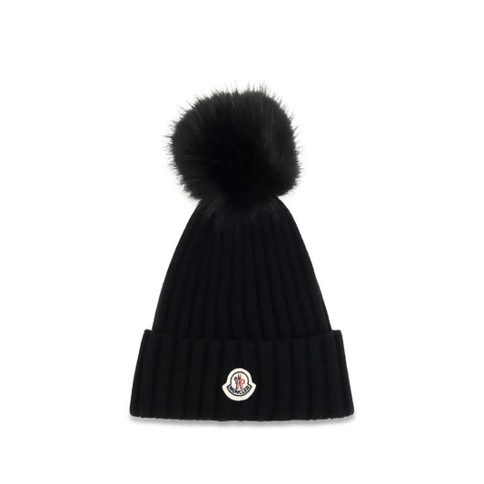 Beanie Hat by Moncler for women in virgin wool black presents a sleek silhouette, showcasing the sleek texture and refined craftsmanship of the Virgin Wool Beanie Hat collection.