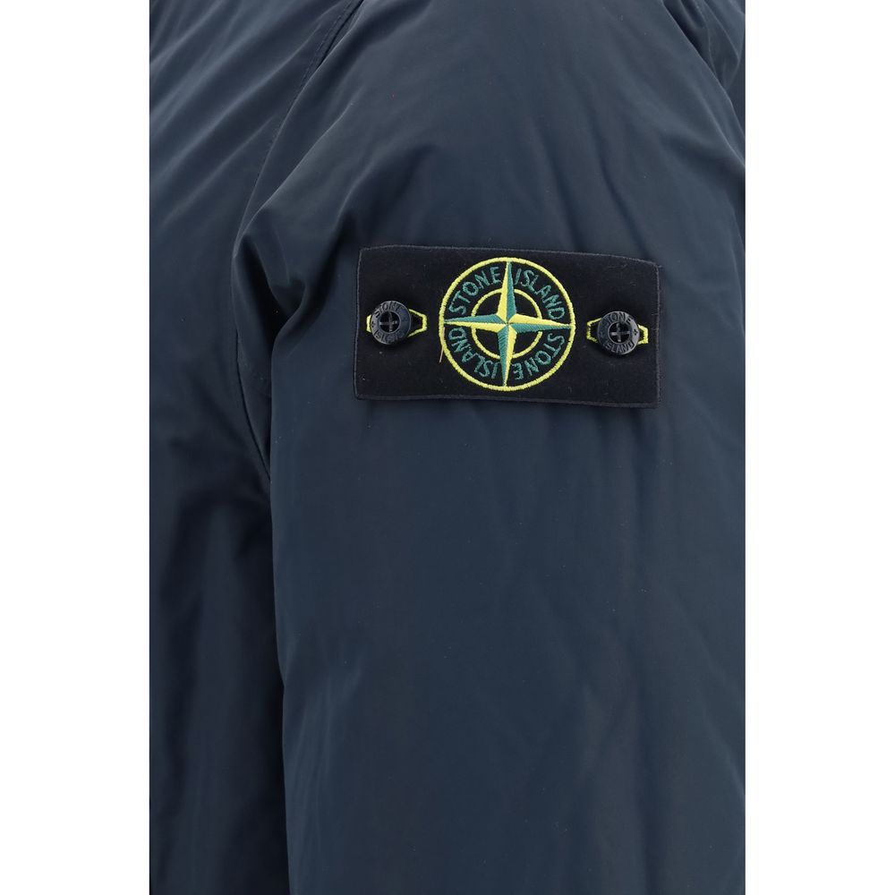 Hooded Puffer Jacket by Stone Island for men in polyester nylon & duck-down blue features a city-ready silhouette, detailed with pockets, hooded & insulated and a city-ready hooded neckline.