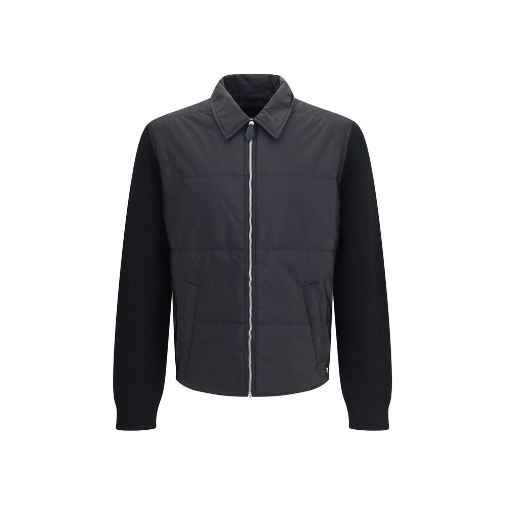 Overcoat by Prada for men in wool & nylon black showcases a architectural silhouette, artfully detailed with a distinctive and functional pockets & insulated for a architectural finish.