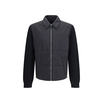 Overcoat by Prada for men in wool & nylon black showcases a architectural silhouette, artfully detailed with a distinctive and functional pockets & insulated for a architectural finish.