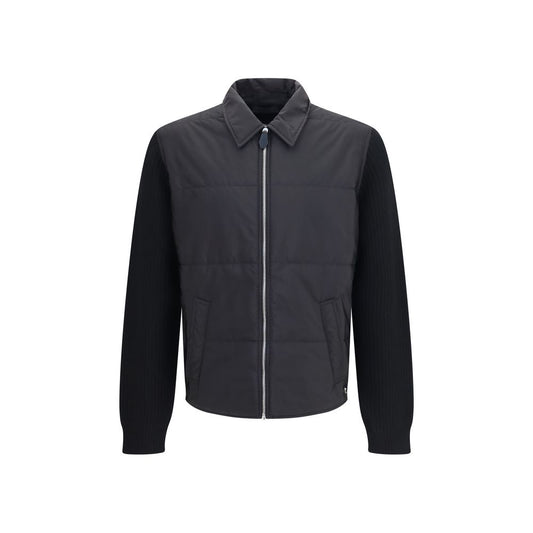 Overcoat by Prada for men in wool & nylon black showcases a architectural silhouette, artfully detailed with a distinctive and functional pockets & insulated for a architectural finish.