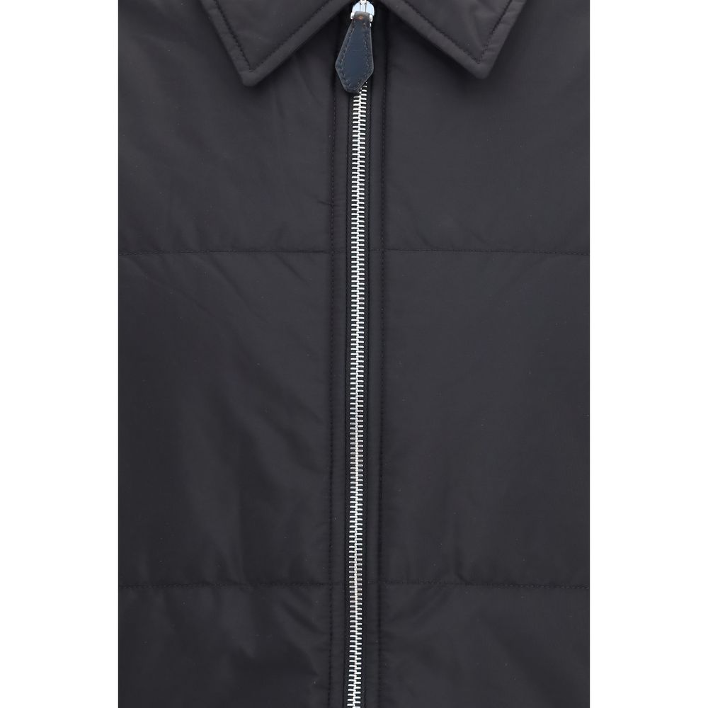 Overcoat by Prada for men in wool & nylon black showcases a architectural silhouette, artfully detailed with a distinctive and functional pockets & insulated for a architectural finish.