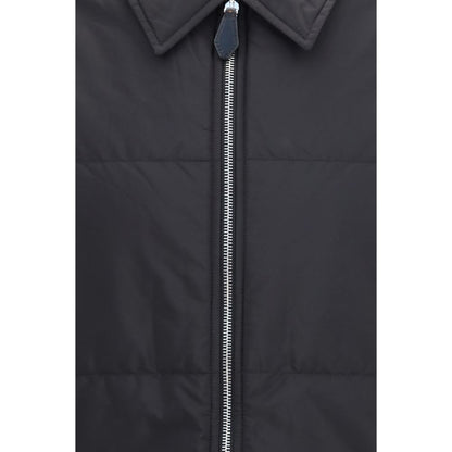 Overcoat by Prada for men in wool & nylon black showcases a architectural silhouette, artfully detailed with a distinctive and functional pockets & insulated for a architectural finish.
