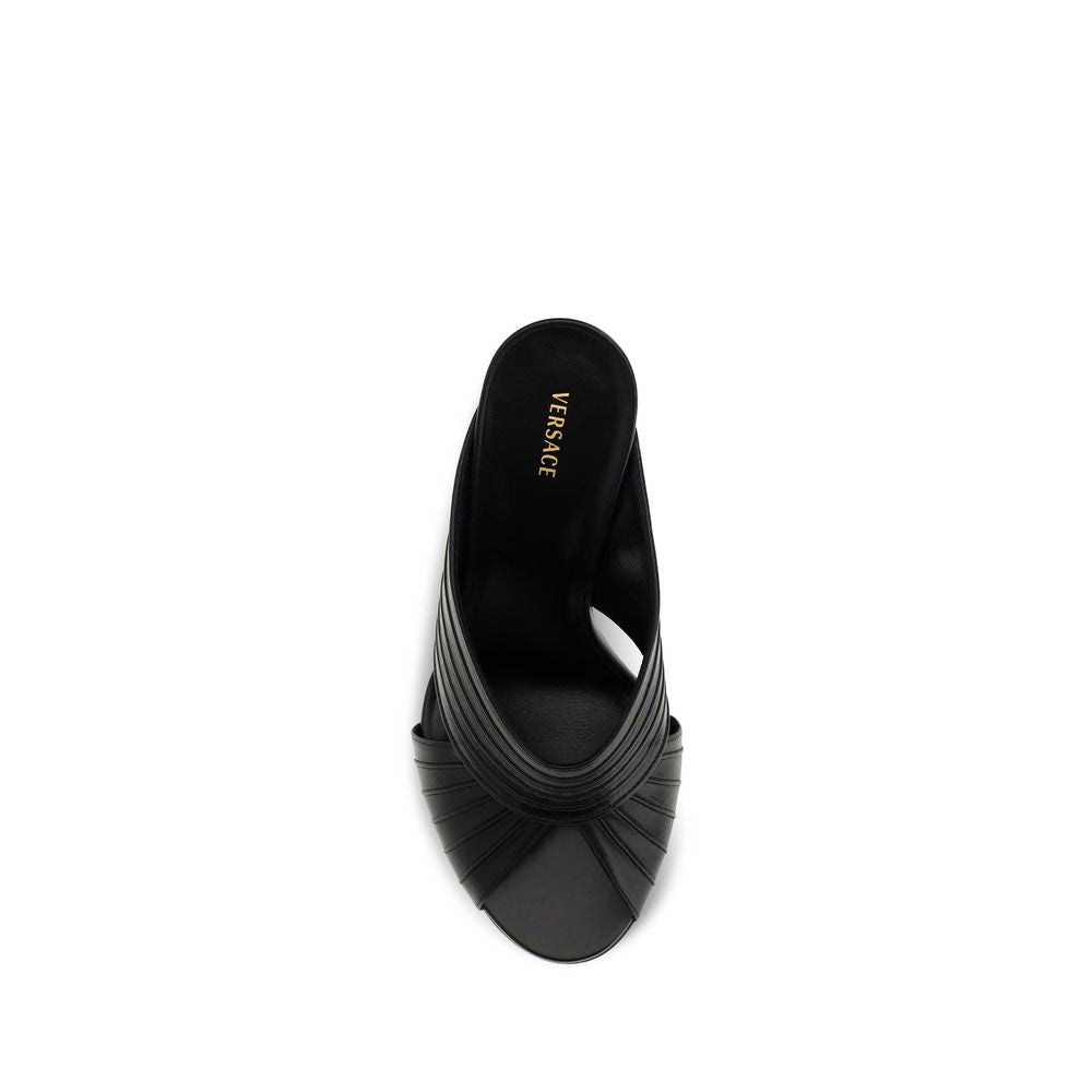 Mules Flat Shoes by Versace for women in nappa leather black showcases a enchanting silhouette as part of the Medusa Women's Nappa Leather Mules Flat Shoes collection, defined by a enchanting open toe style and for a enchanting look.