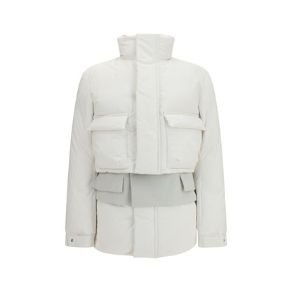 Overcoat by Sacai for women in polyester white features a cosy chic silhouette, artfully detailed with a sophisticated and premium pockets & insulated for a cosy chic finish.