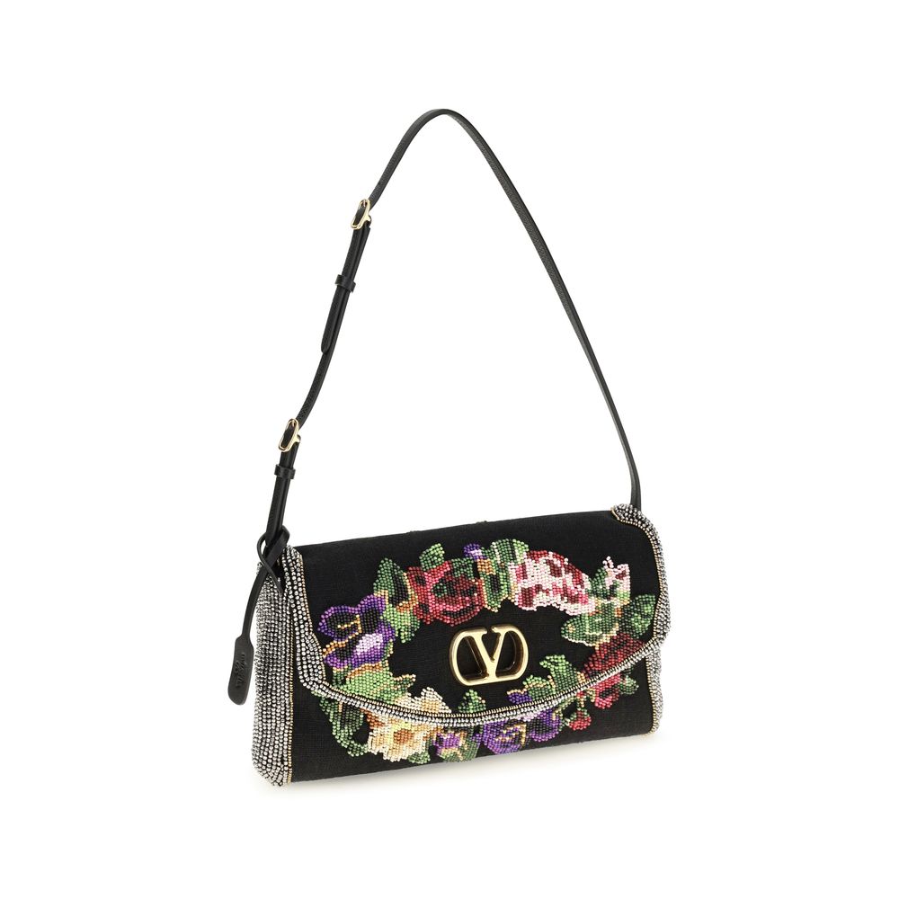 Small Shoulder Bag by Valentino Garavani for women in calfskin leather & linen gold, multicolor, floral & signature features a effortless sophistication silhouette, secured by a magnetic with ample single-compartment and versatile shoulder-strap, adjustable-strap & handle for a effortless sophistication finish.