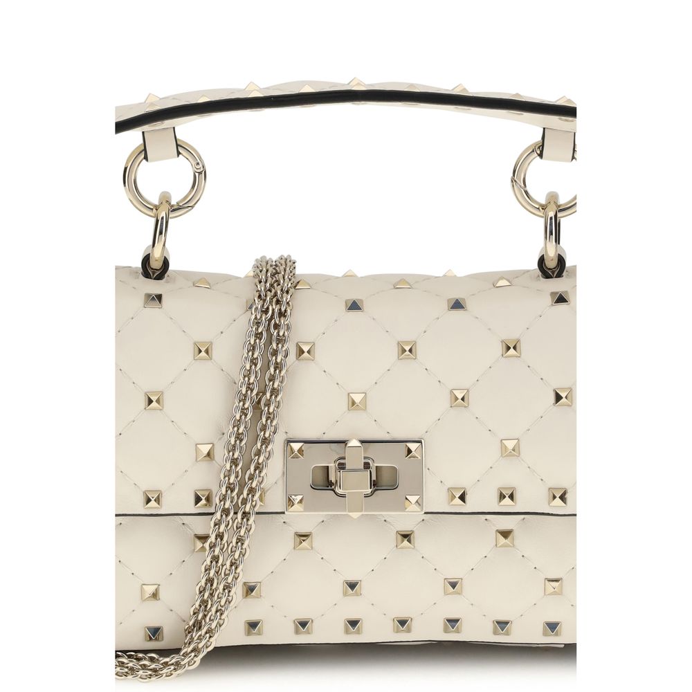 Mini Quilted Handbag by Valentino Garavani for women in nappa leather beige & signature features a contemporary silhouette, showcasing a secure , ample , and contemporary handle & detachable-strap for a sophisticated look.