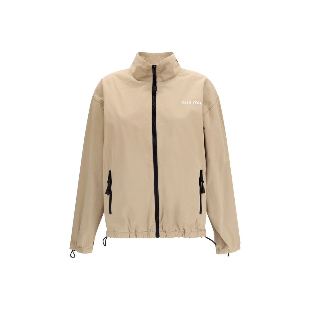 Overcoat by Miu Miu for women in cotton beige features an satoral silhouette, showcasing a sophisticated shirt-collar neckline and satoral pockets for a premium, timeless look.