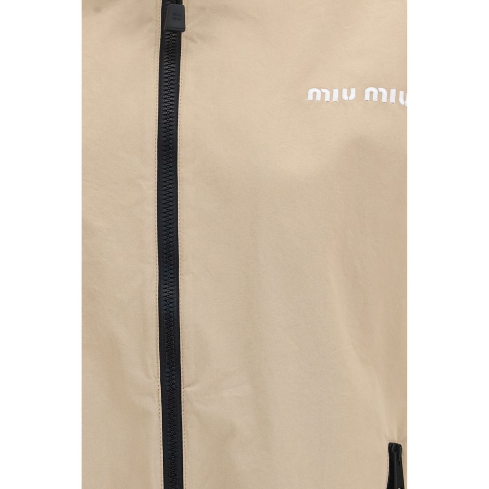 Overcoat by Miu Miu for women in cotton beige features a cosy chic silhouette, artfully detailed with a sophisticated and premium pockets for a cosy chic finish.