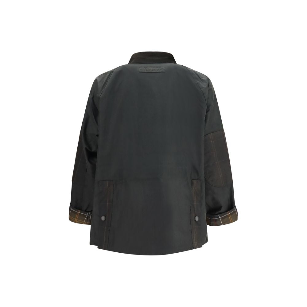 Overcoat by Barbour for men in cotton bicolour & tartan features a contemporary silhouette showcasing a contemporary and refined pockets for a sophisticated finish.