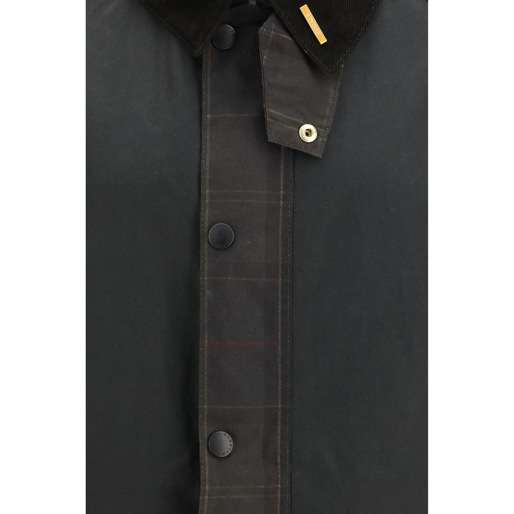 Overcoat by Barbour for men in cotton bicolour & tartan showcases a enveloping silhouette, detailed with distinctive pockets and a enveloping .