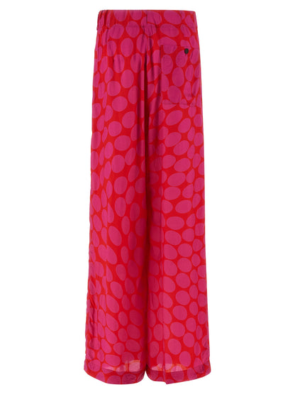 Trousers by Dries Van Noten for women in viscose fuchsia & patterned presents a perennial silhouette, meticulously tailored with a wide cut, long finish, and an elegant .