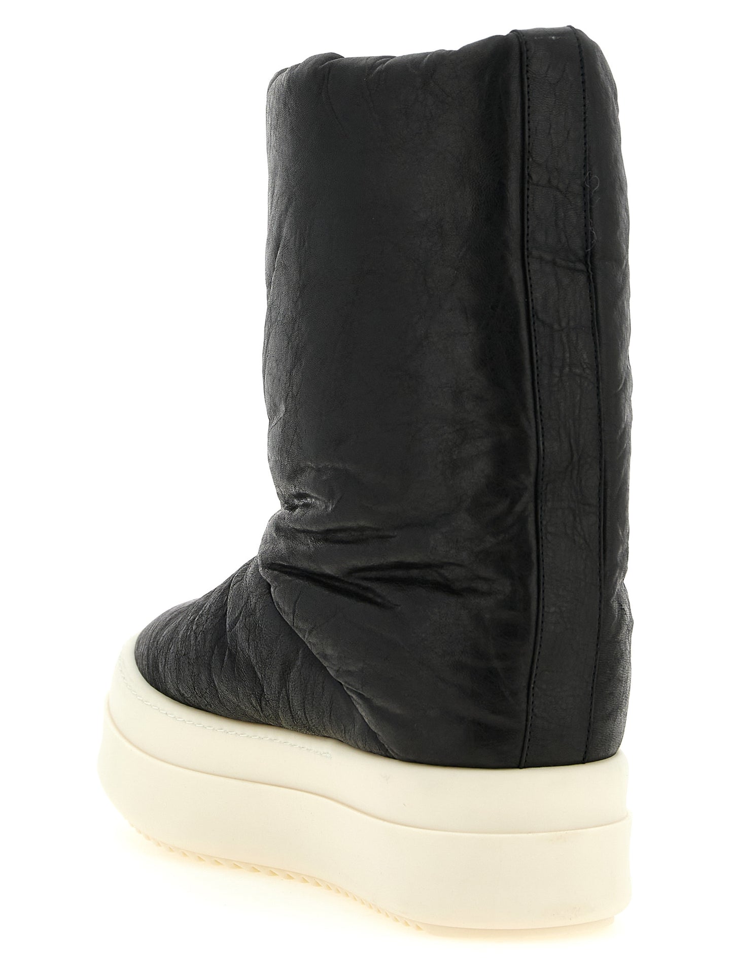 Platform Winter Boots by Rick Owens for men in lamb leather bicolour, black, cream & white showcases a ergonomic silhouette from the Men's Lamb Leather Platform Winter Boots collection, featuring a ergonomic platform and a ergonomic .